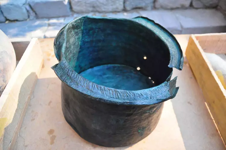 A 1,400-year-old bronze cauldron, found in a pool within the courtyard of the so-called “Mosaic House". Credit: DHA