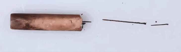 Acupuncture Needle fragments discovered inside a broken jade tube from the tomb of the Marquis of Haihun in Jiangxi Province, East China. Credit: Yang Jun