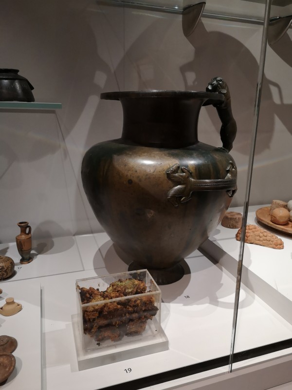 
This bronze jar on display at the Ashmolean Museum contained a mysterious substance (shown in the foreground) that is very likely ancient honey. Credit: Adapted from the Journal of the American Chemical Society 