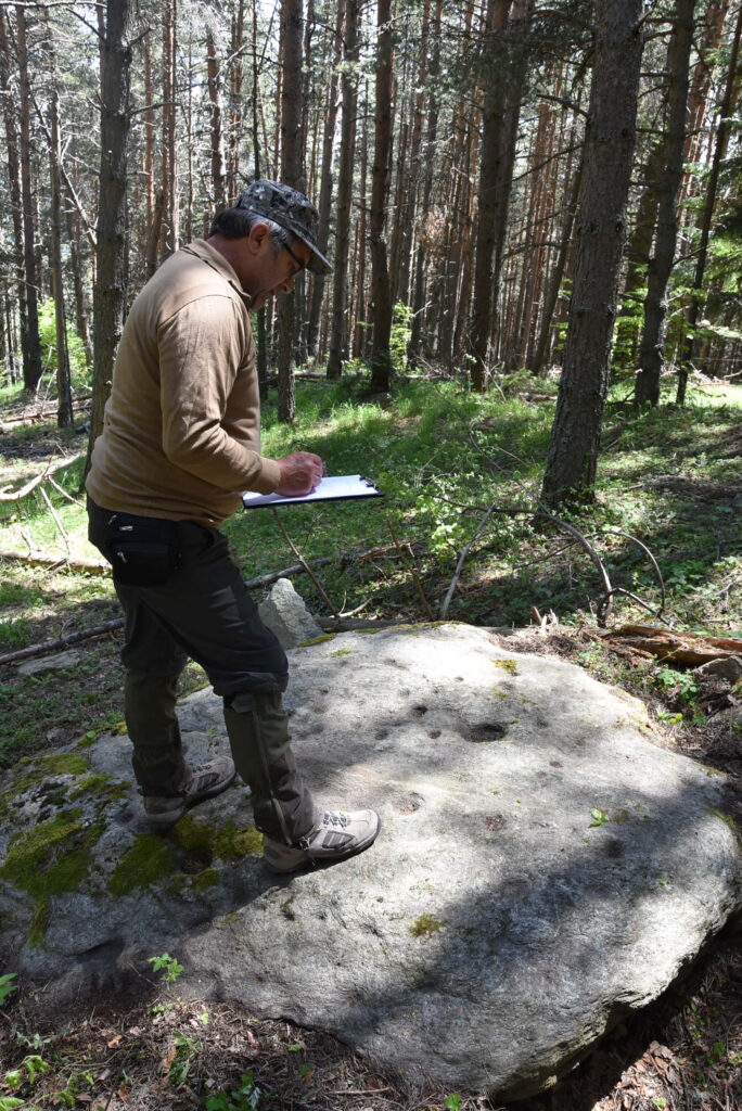 Researcher Georgi Georgiev meticulously studying the ancient stone. Photos courtesy of Georgi Georgiev.