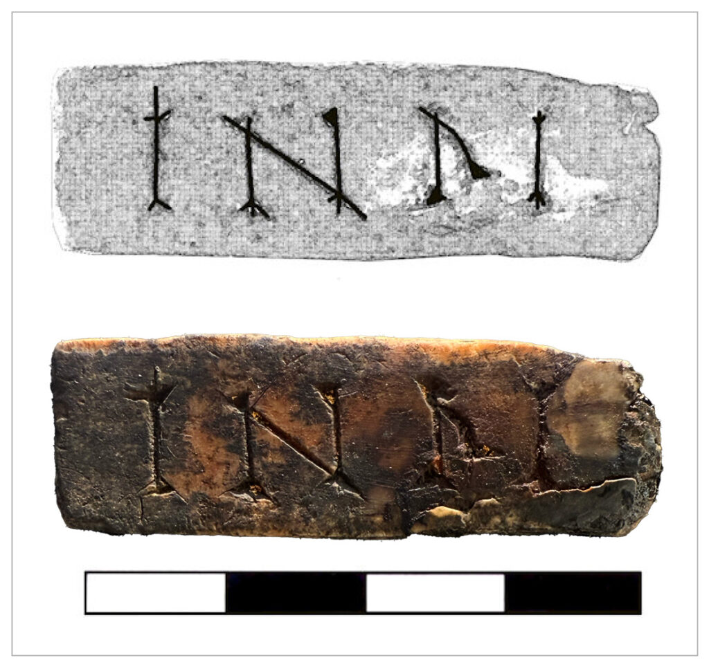 Ivory incised with the letters “INRI” (Iesus Nazarenus Rex Iudaeorum). Credit: Center for Historic Shipwreck Preservation.