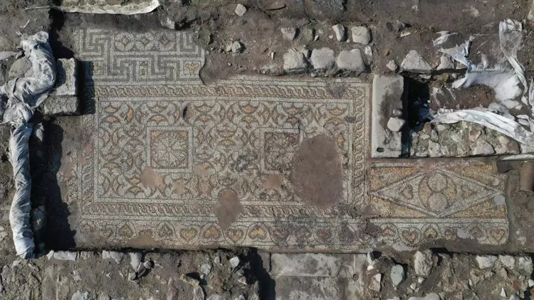 The discovery was made near the Red Basilica (Kızıl Avlu), in an area referred to as the “Mosaic House” due to its richly decorated floors. Credit: DHA