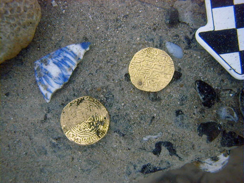 Two gold coins, one originating from the Sherifian Empire and the other from the Ottoman Empire, minted between the late 17th and early 18th centuries. Credit: Center for Historic Shipwreck Preservation.