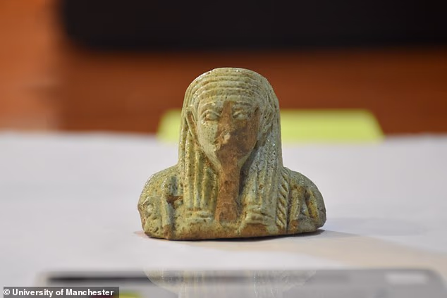 Archaeologists found a glazed ceramic funerary figurine called an ushabti. Credit: University of Manchester