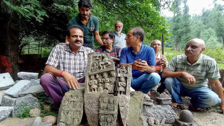 Ancient stone idols, including intricately carved Shivlings, unearthed during spring restoration work at Karkoot Nag in Anantnag district, Jammu & Kashmir. | Credit: PTI Photo