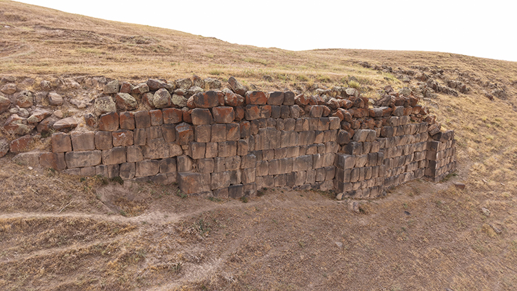 Constructing 9-meter-wide walls with multi-ton basalt blocks stands as a remarkable feat of Urartian engineering and architectural mastery. Credit: AA
