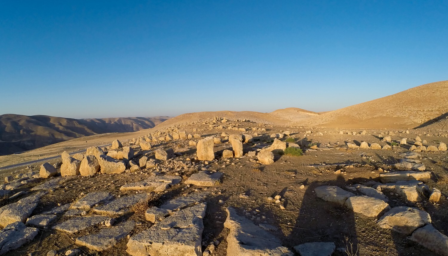 View of the central knoll (Area 1) from the north, highlighting multiple alignments of standing stones. Image: The Ritual Landscapes of Murayghat Project / Susanne Kerner
