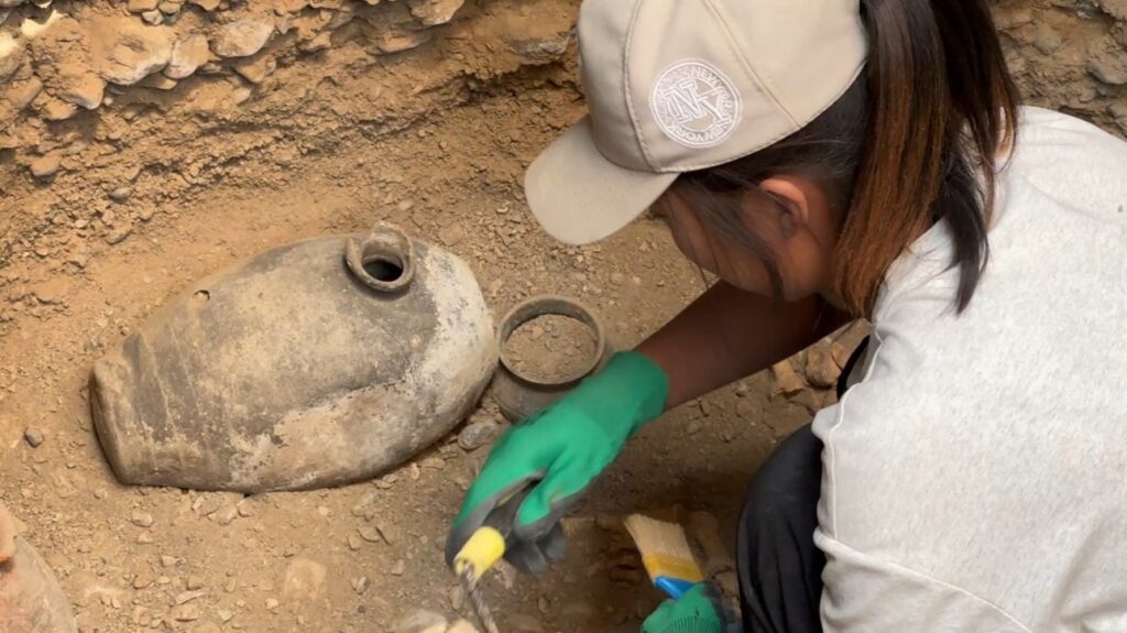 Alongside the skeletal remains, archaeologists have already uncovered numerous artifacts, including pottery. Credit: Batken State University