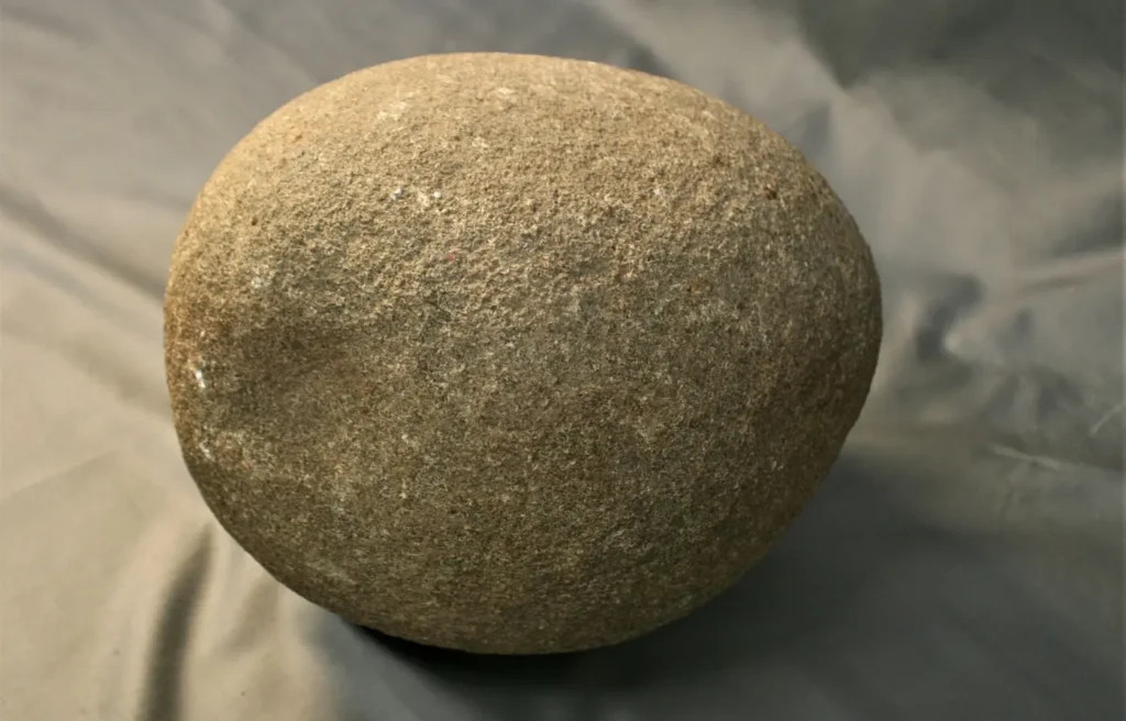 A grave orb from Södermanland, featuring a dent on one edge. The stone dates between 500 and 1000 CE, according to the Sörmland Museum. Credit: Sörmland Museum