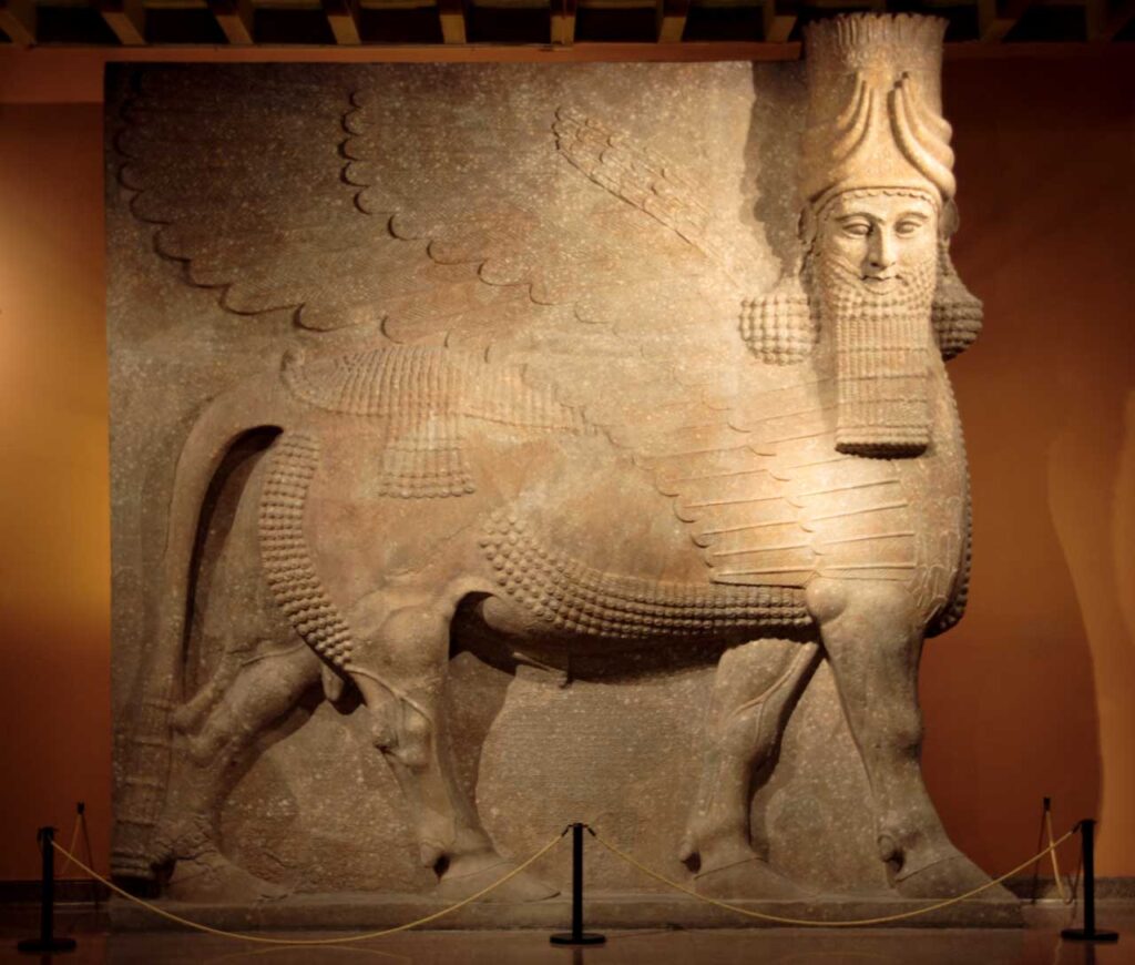 Lamassu from the Neo-Assyrian Empire, dating to around 721–705 BCE. This example, on display at the British Museum, illustrates the protective winged bull figures that once guarded Assyrian palaces. It is shown here for context only and is not the newly discovered statue in Mosul. Credit: Public Domain