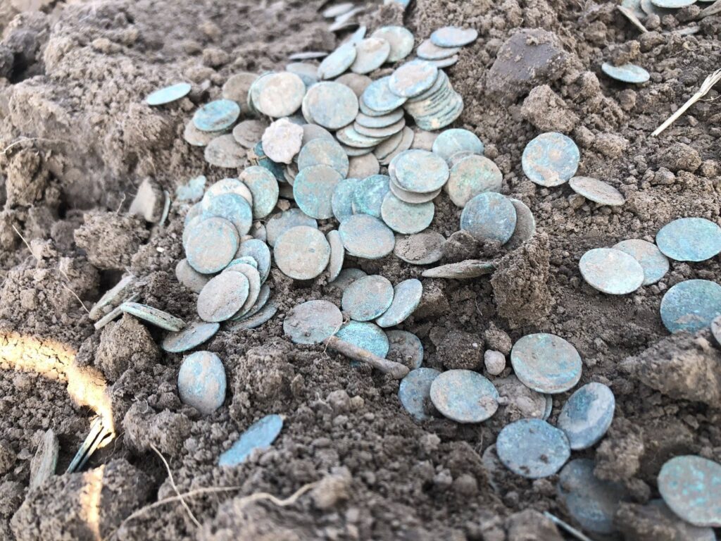 The copper coins are being extracted from the ground. Credit: Lubelski Wojewódzki Konserwator Zabytków