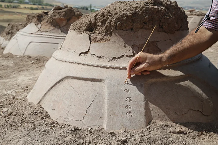 The 76 Urartian pithoi unearthed at Kevenli Castle were carefully marked with cuneiform measurements for storing oil, grain, and beverages during the Iron Age. Credit: AA