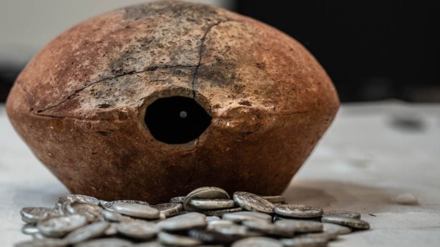 A vase containing 409 silver coins dating back more than 2,300 years and linked to Alexander the Great found in Arabia. Credit: Sharjah Archaeology Authority (SAA)