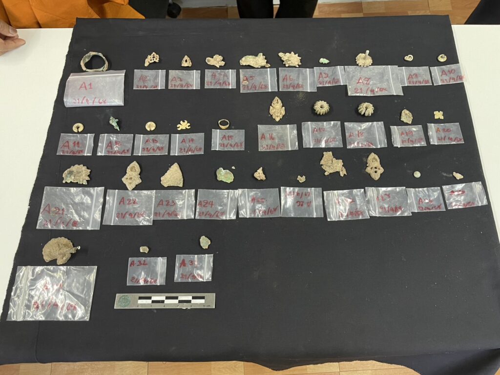 A collection of 33 metal ornaments made of bronze, silver, and gold, discovered in a ceramic container. Credit: Thailand’s Fine Arts Department