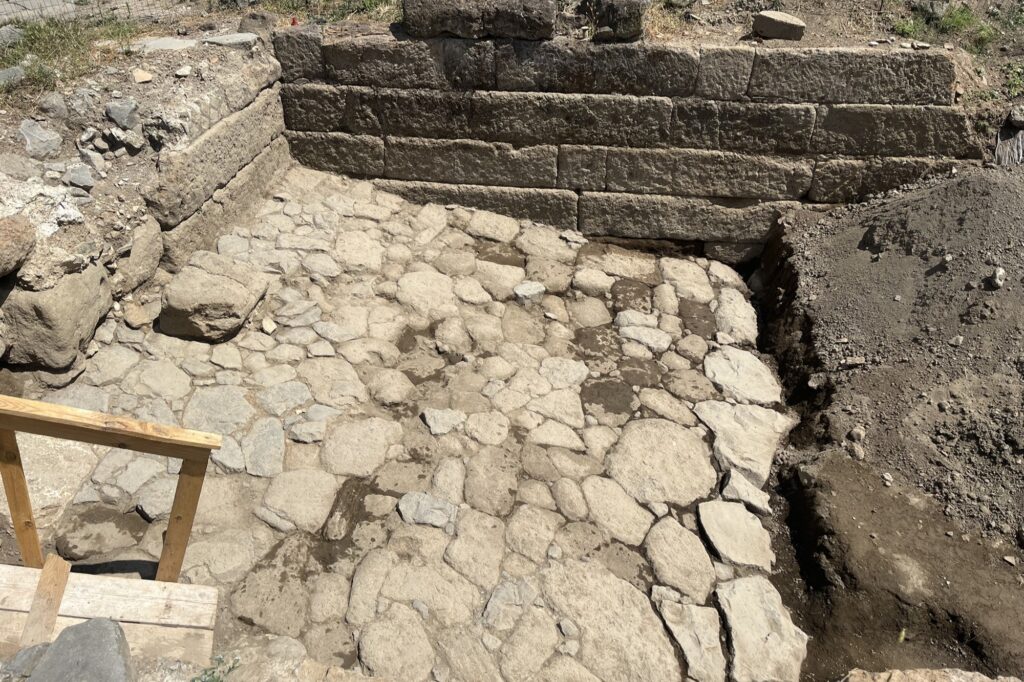 In the heart of the ancient Roman city of Gabii, located just 11 miles east of Rome, archaeologists discovered the remains of a massive stone-lined basin, partly carved directly into the bedrock. Credit: Marcello Mogetta