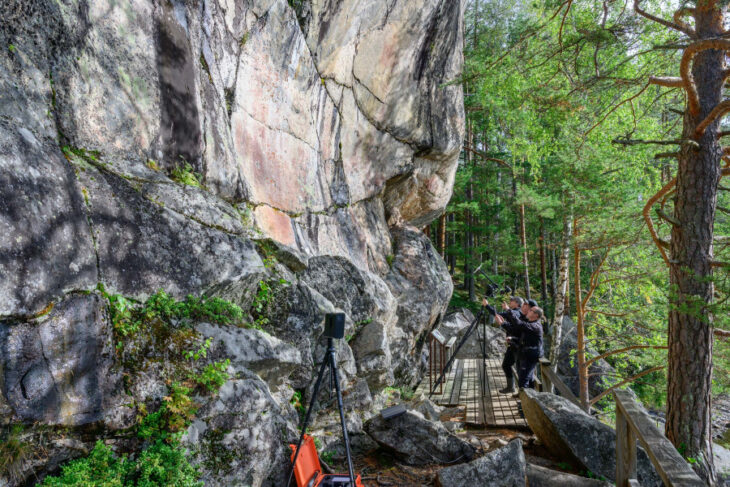 Researchers Veikko Miettinen, Dmitri Semenov, and Rami Saarikorpi at the Astuvansalmi rock cliffs in Finland. University of Eastern Finland