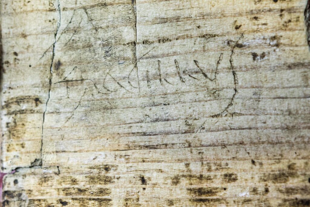 Detail of the graffiti inscribed on the back of a Roman writing tablet. Credit: Flore Giraud, Inrap
