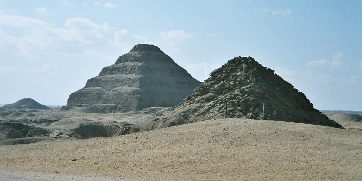 View of Saqqara necropolis, including Djoser's step pyramid (centre), the Pyramid of Unas (left) and the Pyramid of Userkaf (right)