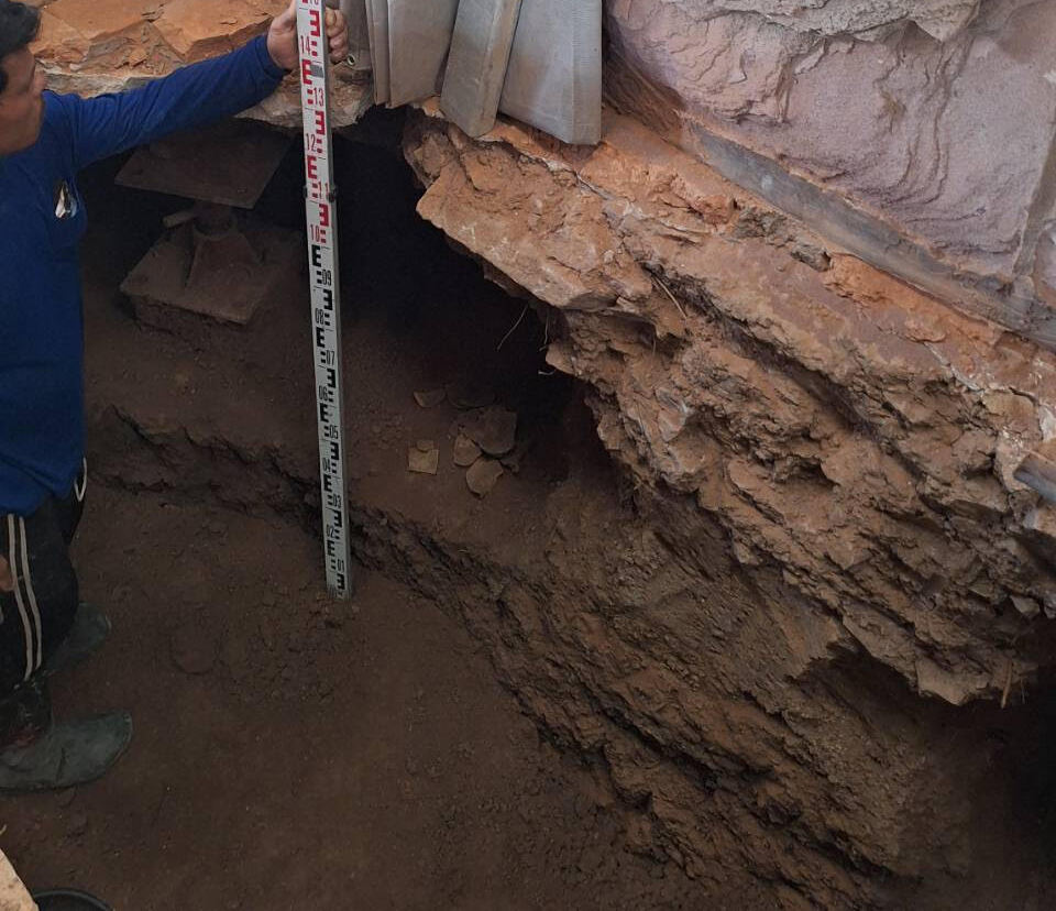 Excavation site where metal ornaments were discovered in a ceramic container beneath the reclining Buddha, between the elbow and chest area. Credit: Thailand’s Fine Arts Department