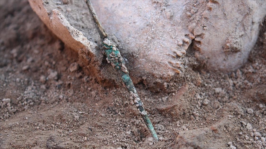 One grave belonged to an adult male thought to be a hunter, laid to rest with bronze harpoon points, while the other contained the remains of a six-year-old child wearing bracelets
