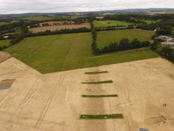 Aerial view of the Roman road connecting Vorgium to Quimperlé in the foreground. In the background, modern parcel boundaries still follow the trace of the ancient route. Credit: Florian Cousseau, Durham University