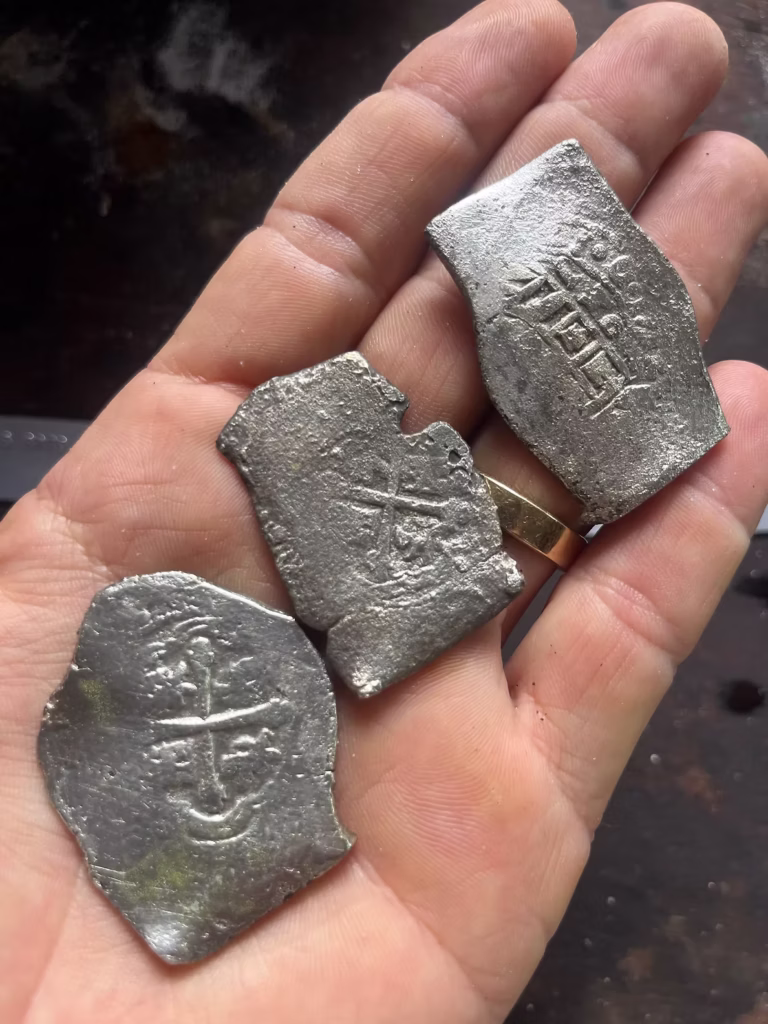 Over 1,000 Spanish silver reales and gold escudos recovered from the 1715 Treasure Fleet shipwreck, valued at $1 million. Credit: 1715 Fleet - Queens Jewels