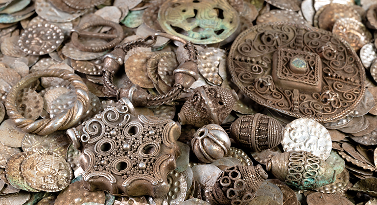 Some of the coins and silver objects included in the discovered hoard. Credit: Stockholm County Administrative Board