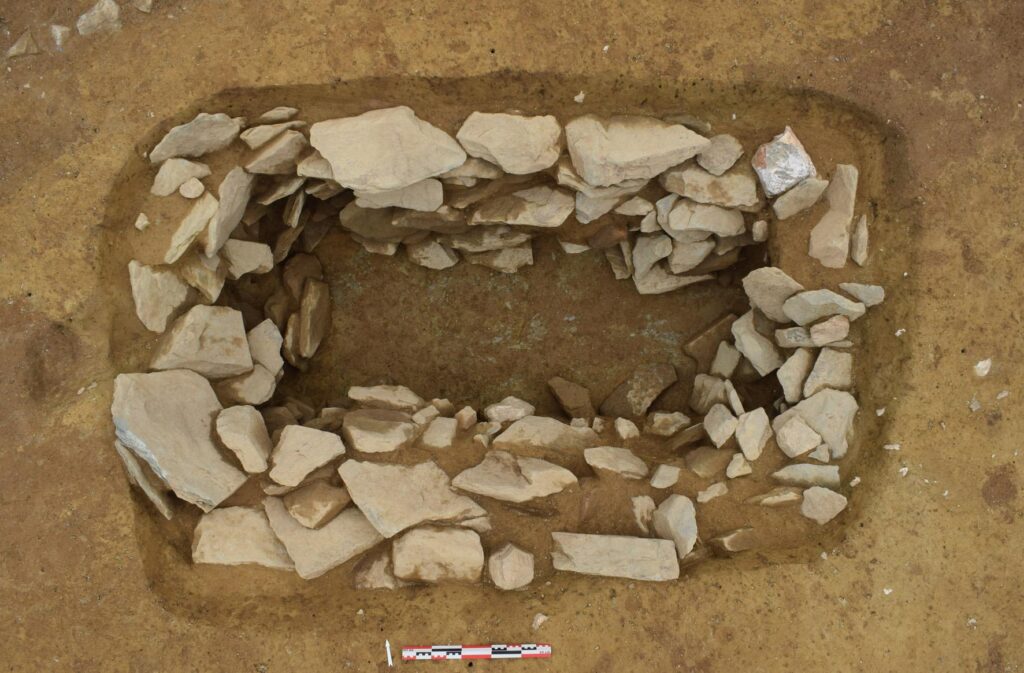 Wooden coffin burial. The wooden planks were supported by stone blocks placed inside the tomb. Credit: S. Blanchet, Inrap