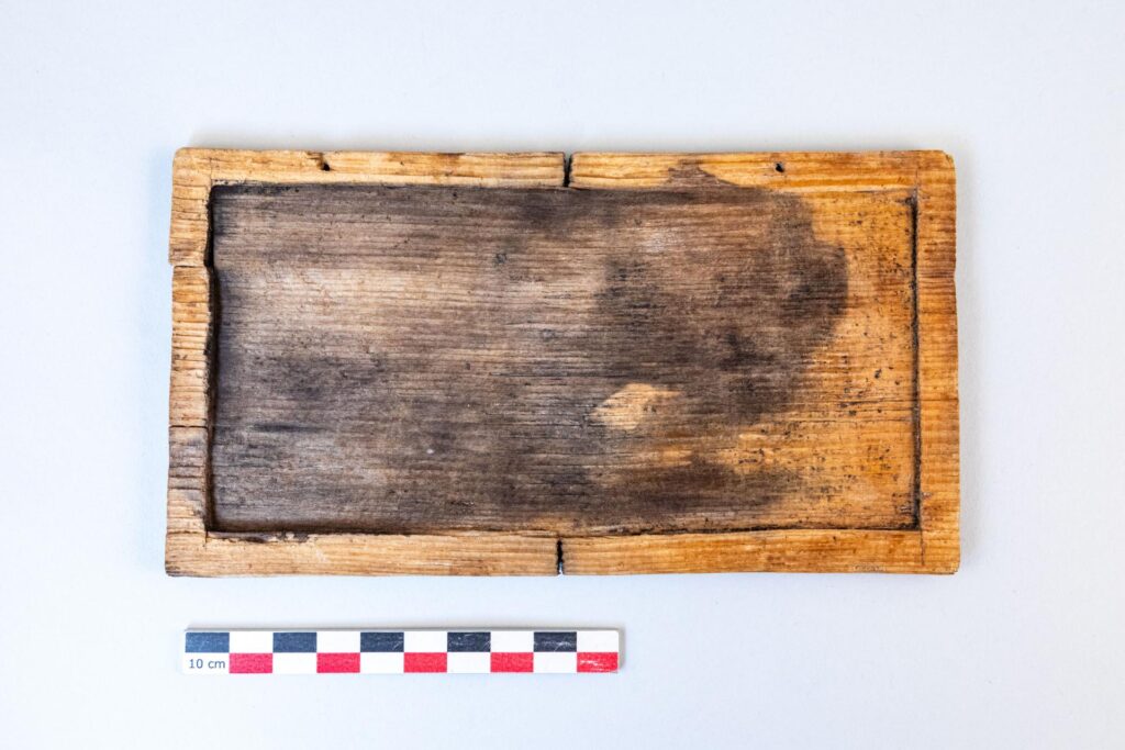 Writing tablet fully hollowed on this side, belonging to the second leaf of a triple-leaved codex. Credit: Flore Giraud, Inrap