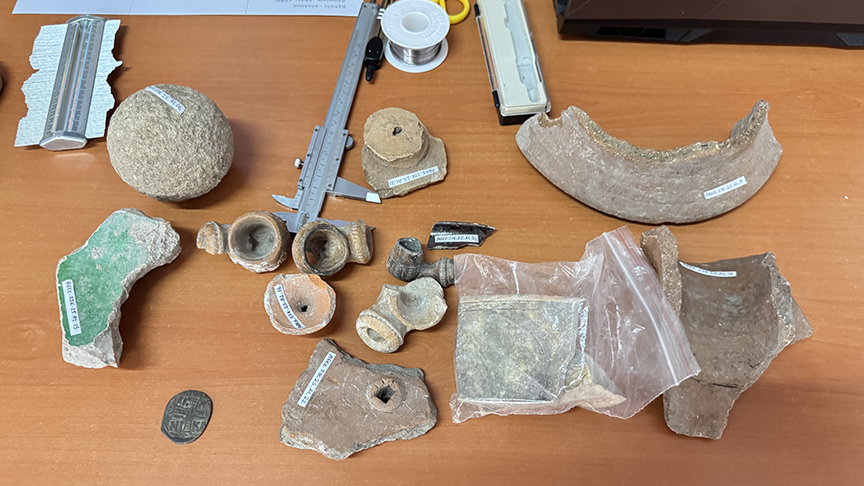 Byzantine coins, ceramic fragments, and stone and metal cannonballs, remnants of centuries of conflict and commerce.. Credit: Yusuf Okur/AA