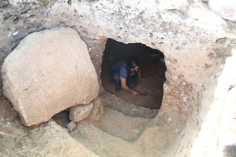 Archaeologists work on Soğmatar’s 23-meter-high mound and its rock-cut necropolis, a sacred landscape used for millennia. Credit: AA