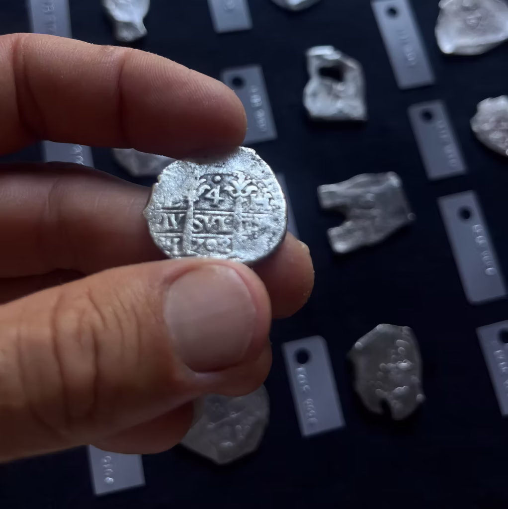 Over 1,000 Spanish silver reales and gold escudos recovered from the 1715 Treasure Fleet shipwreck, valued at $1 million. Credit: 1715 Fleet - Queens Jewels