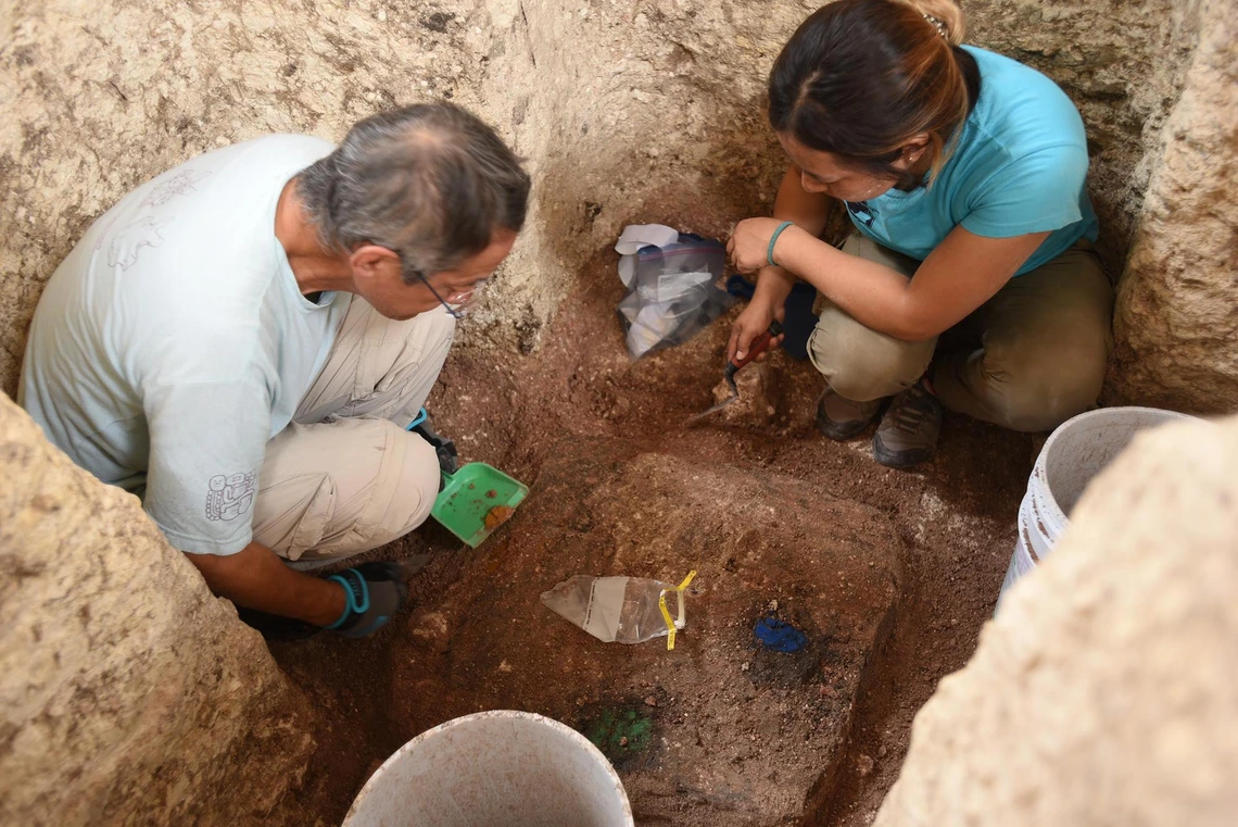 Archaeologists Takeshi Inomata and Melina Garcia excavate ceremonial artifacts with pigments linked to the four cardinal directions. Credit: University of Arizona - Atasta Flores