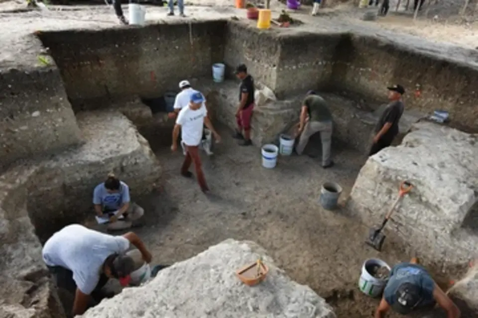 Archaeologists excavating the cruciform, before discovering the cache in the center of the pit. Credit: Takeshi Inomata/School of Anthropology