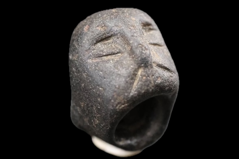 Basalt bead with human faces from Sefertepe. Credit: Republic of Türkiye Ministry of Culture and Tourism.