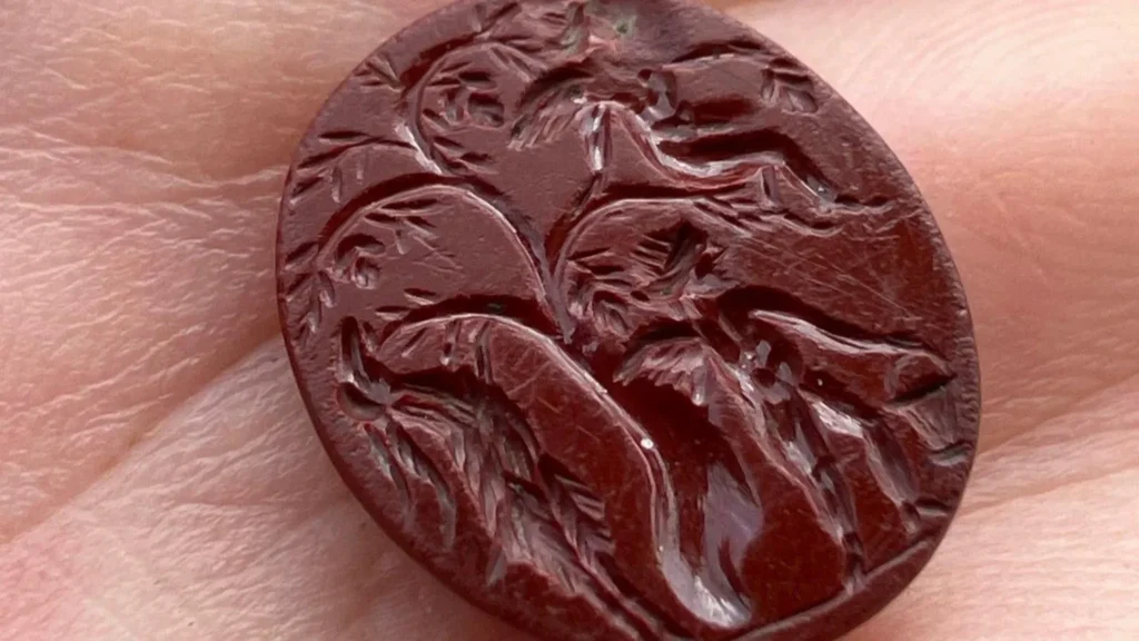 The carved gem or ‘intaglio’ found at the Bremenium Fort site in High Rochester, Northumberland. Credit: Elaine Vallack via BBC