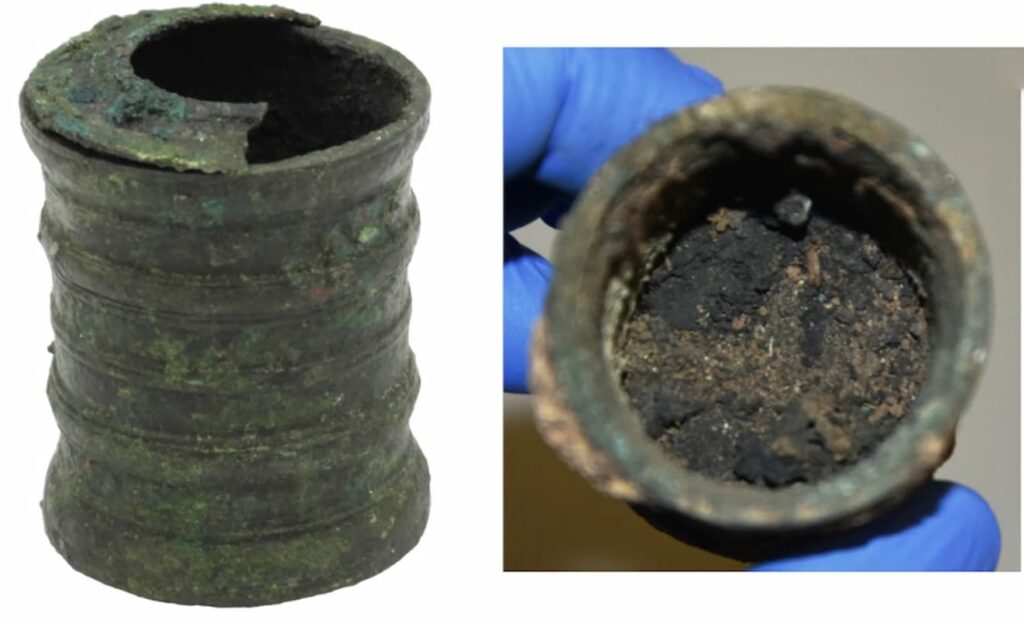 Photograph of the inkwell after cleaning, showing its preserved surface, alongside an excavation view of the interior revealing sediment and residue distribution. Credit: C. Oliveira et al., 2025.