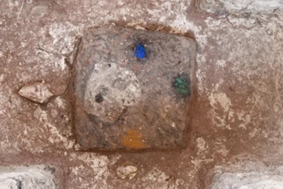 Mineral pigments in the cruciform cache were arranged to correspond with cardinal directions, according to recorded rituals: Blue azurite to the north, green malachite to the east and yellow ochre with geothite to the south. The western side of the cache included soil and likely other material that began as red and faded over time. Credit: Takeshi Inomata/School of Anthropology