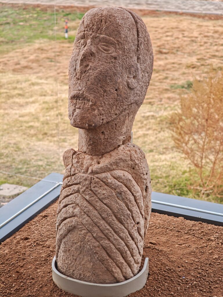 The Sayburç sculpture, depicting a face with a sealed mouth and evoking the stillness of death, is considered a unique insight into early Neolithic mortuary symbolism.