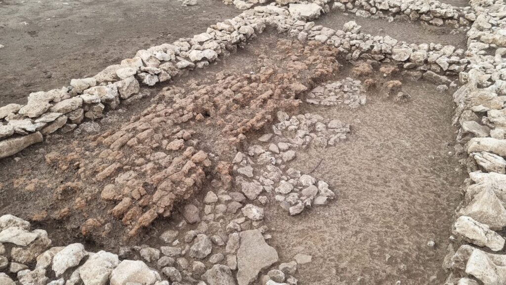 The collapsed southern wall of the Early Bronze Age building at Çayönü, preserved in situ. Credit: IHA