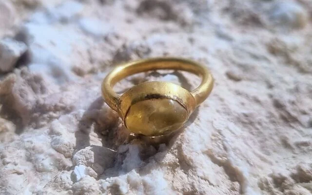 A gold ring set with a yellow stone, dating to the Byzantine period, was discovered in late 2025 at Hyrcania in the Judean Desert, West Bank. Credit: Michal Haber / Institute of Archaeology, Hebrew University of Jerusalem