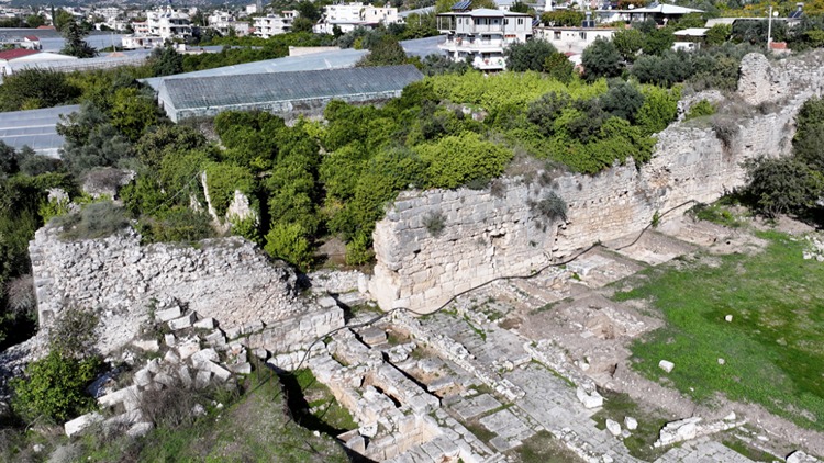Recent excavations show that the gate beneath the Roman street was originally the ceremonial entrance to the Classical-era Zeus sanctuary. Credit: AA