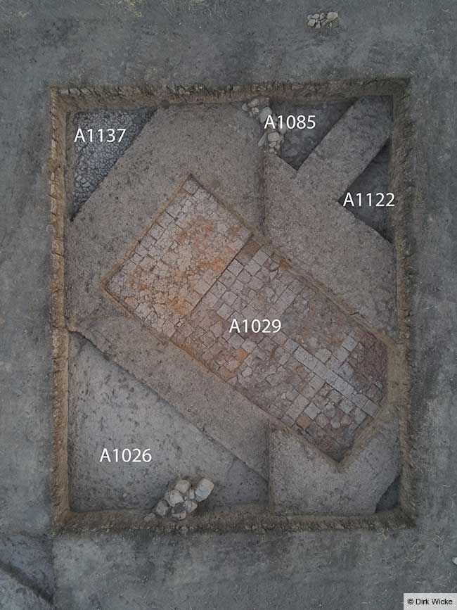 Another major surprise in Area A: a room with a neatly paved baked-brick floor, featuring a semicircular apse at its northeastern end. Credit: Dirk Wicke