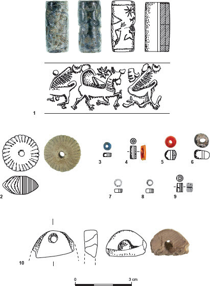 Artefacts found inside Urn 1014/1: cylindrical seal and beads. Credit: Peleg et al., 2025