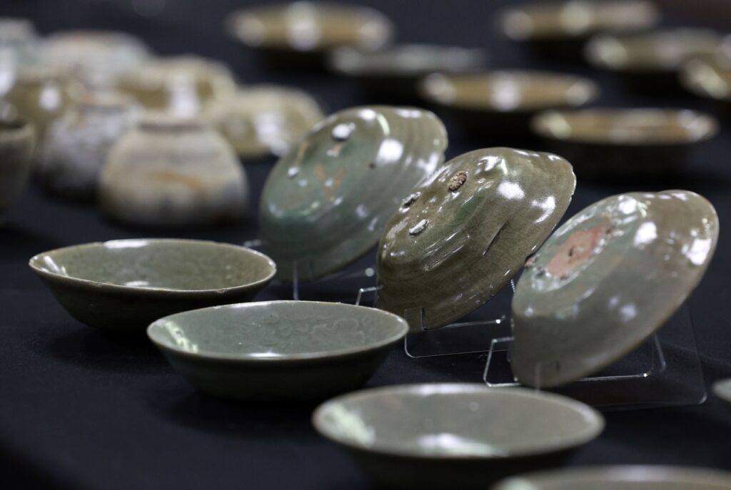 Goryeo-era celadon bowls recovered from the seabed off Taean are displayed at the National Palace Museum in Seoul. Credit: Yonhap News Agency