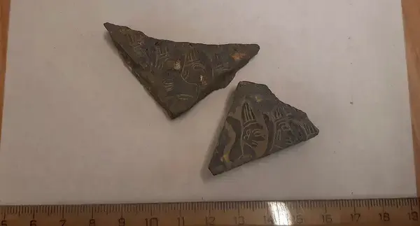 These fragments were discovered two years ago in Kateřinská Cave and likely formed a single object together with the newly found piece. They depict Hittite deities. Credit: Petr Zajíček - Správa Jeskyní CR