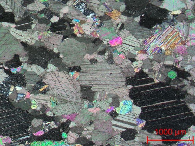 
Microscopic image of the marble sample from the white area of the tombstone under a polarization microscope, showing the characteristic, uneven-grained 'mortar' texture of Proconnesian marble. Credit: Institute of Archaeological Sciences, Ruhr University Bochum, Vilma Ruppiene