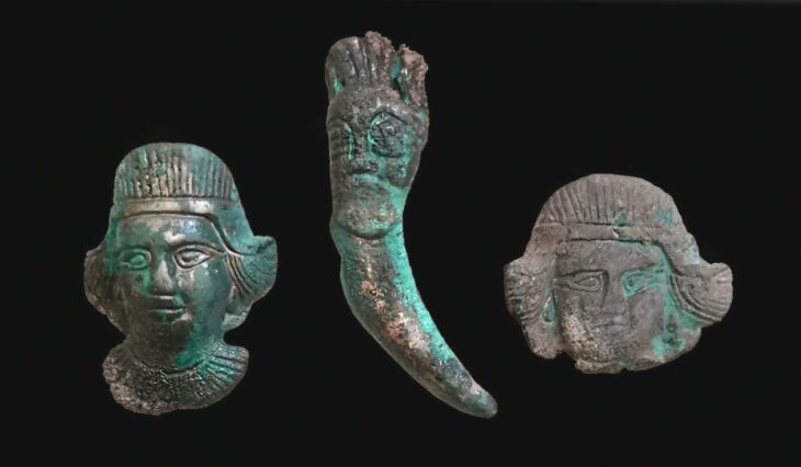 Bronze strap distributors and a pendant from a 4th-century BC nomadic ritual complex.