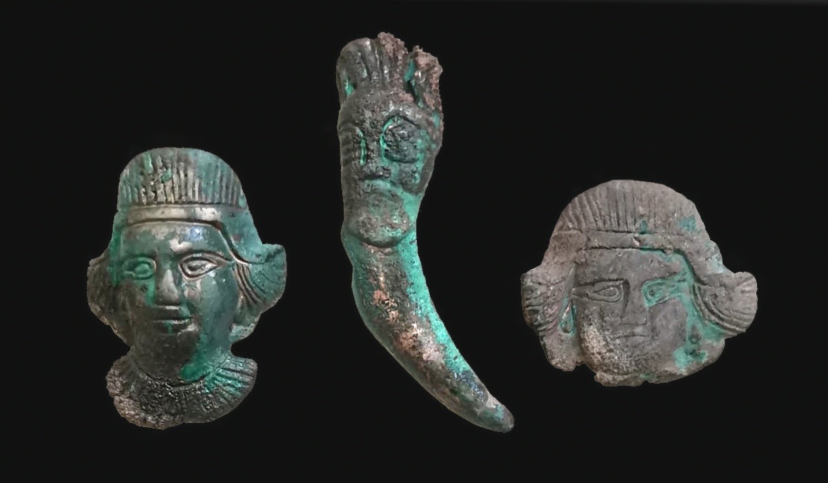 Bronze strap distributors and a pendant from a 4th-century BC nomadic ritual complex.
