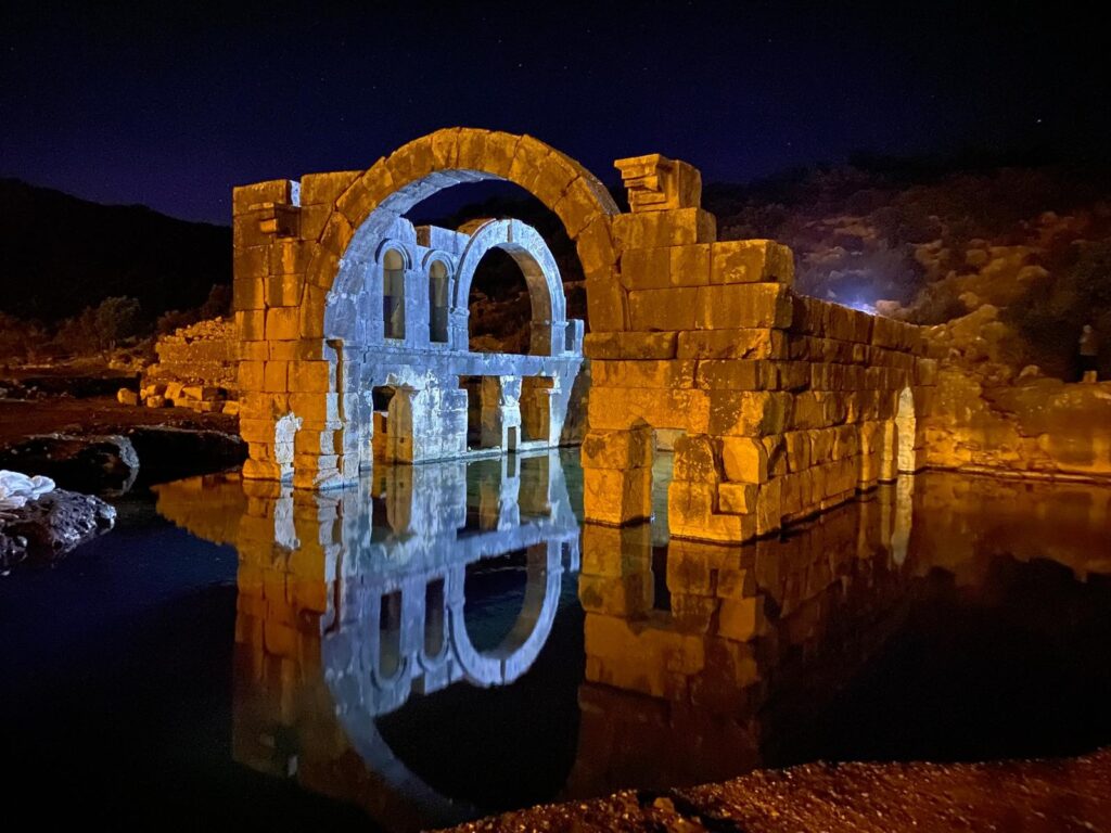A 2.5-meter-high protective barrier wall surrounds the structure, safeguarding the ancient mudbrick walls and preventing surface water from flooding the site. Credit: İHA